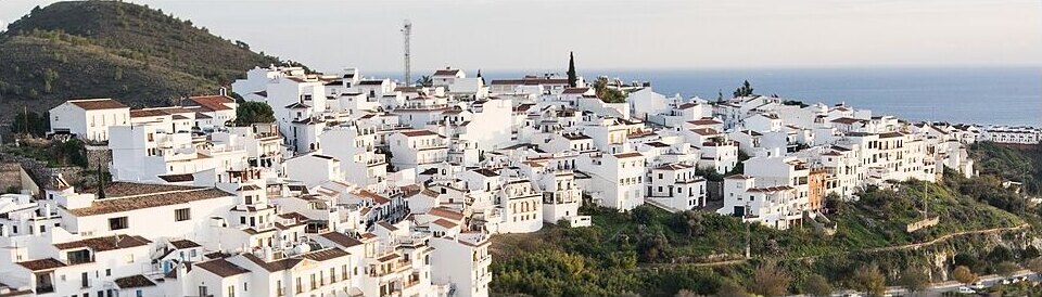 Frigiliana white village spread below the mountains